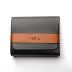 black wallet with a brown strap featuring the brand 'AVIAL' on a white background lockfold 1.0, trifold wallet, leather wallet, flap lock, black and matt tan