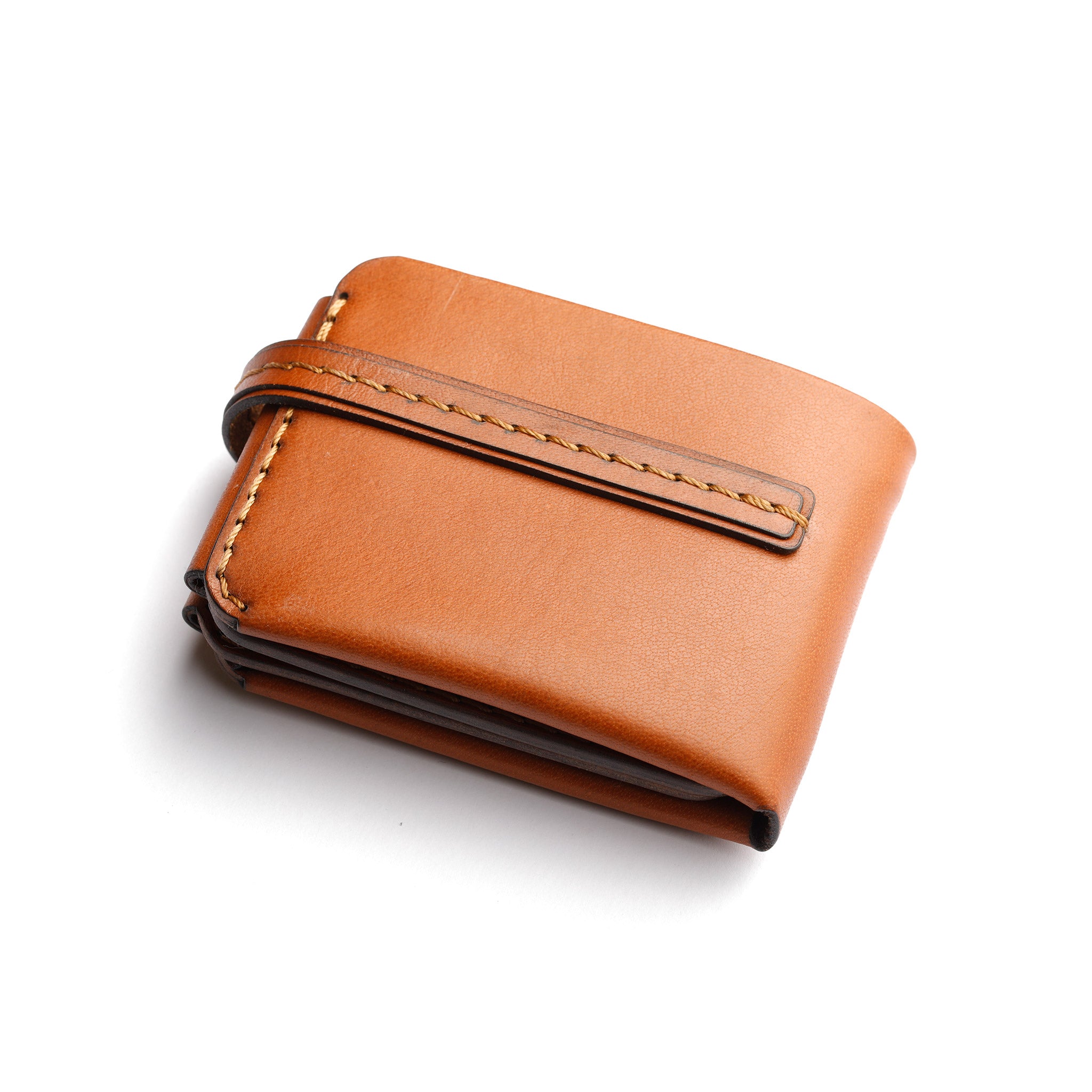 back side view of The Monarch 10-Slot Traveler trifold wallet, premium full-grain leather, stylish tanned accessory