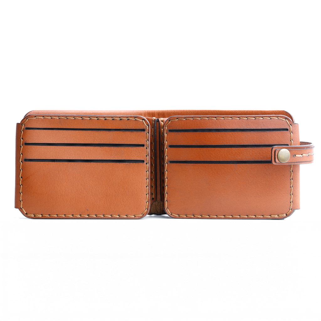 The Monarch 10-Slot Traveler capacity demonstration, holding 10 cards and cash, classic tanned leather