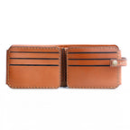 The Monarch 10-Slot Traveler capacity demonstration, holding 10 cards and cash, classic tanned leather