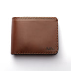 Brown leather wallet with 'AVIAL' branding on a white background