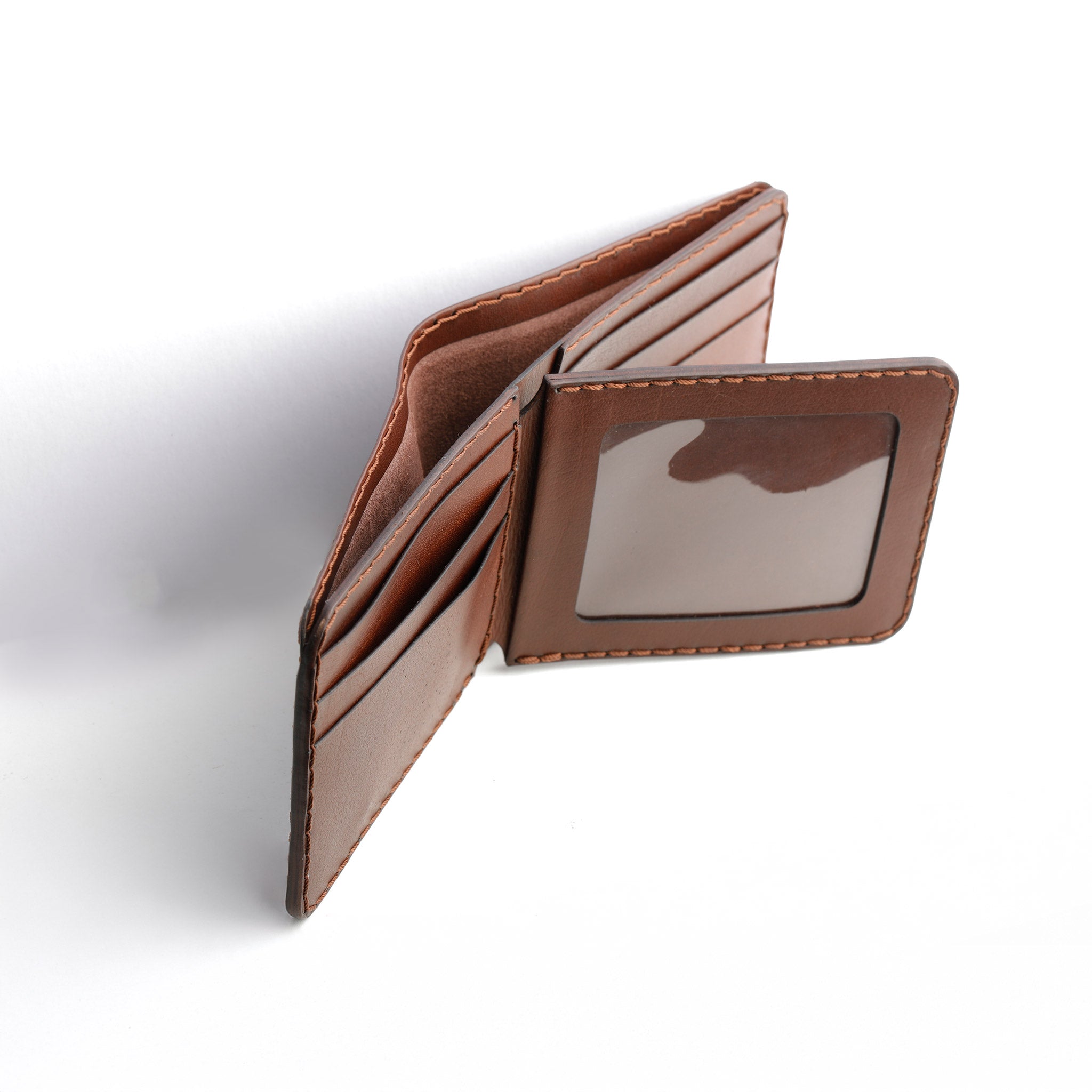 A detailed photo of the bifold wallet open, showing a cash compartment and multiple card slots ready for use