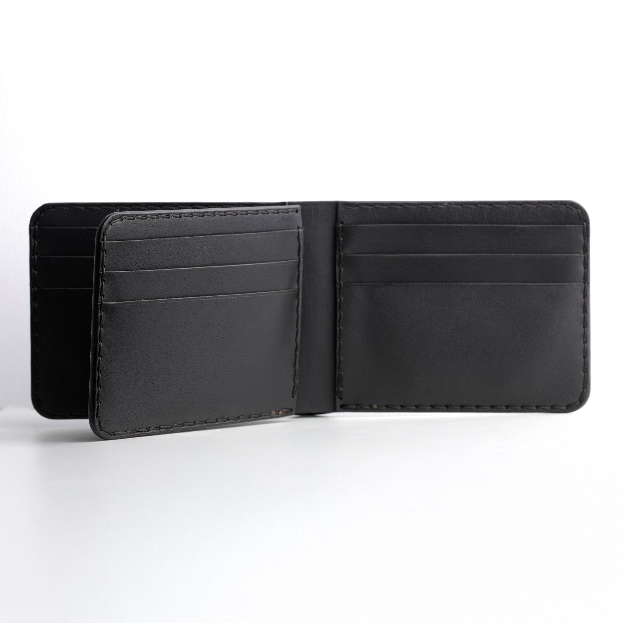 A close-up front view of the Black Luxury Bifold Three-Layer Leather Wallet, showcasing its rich texture.