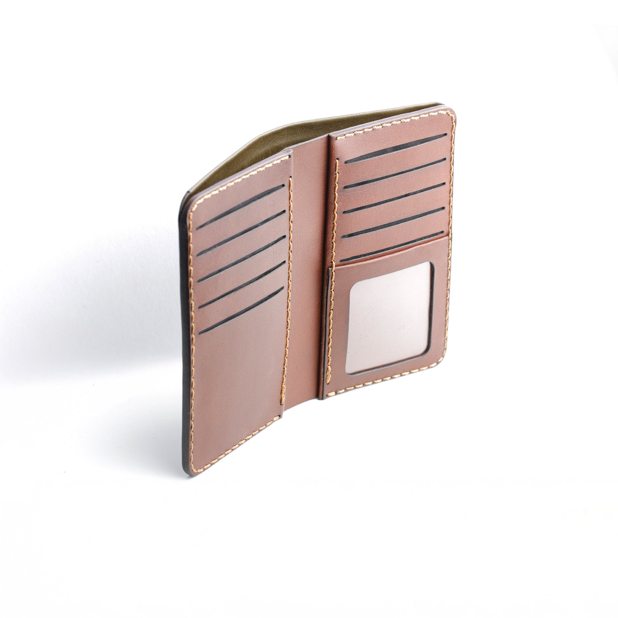  detailed photo of The Maverick Two-Tone Long Wallet open, showing a cash compartment ready for use.