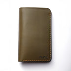 Green leather wallet with brown stitching on a white background maverick two-tone long wallet, men's wallet, olive green and brown, luxury leather good